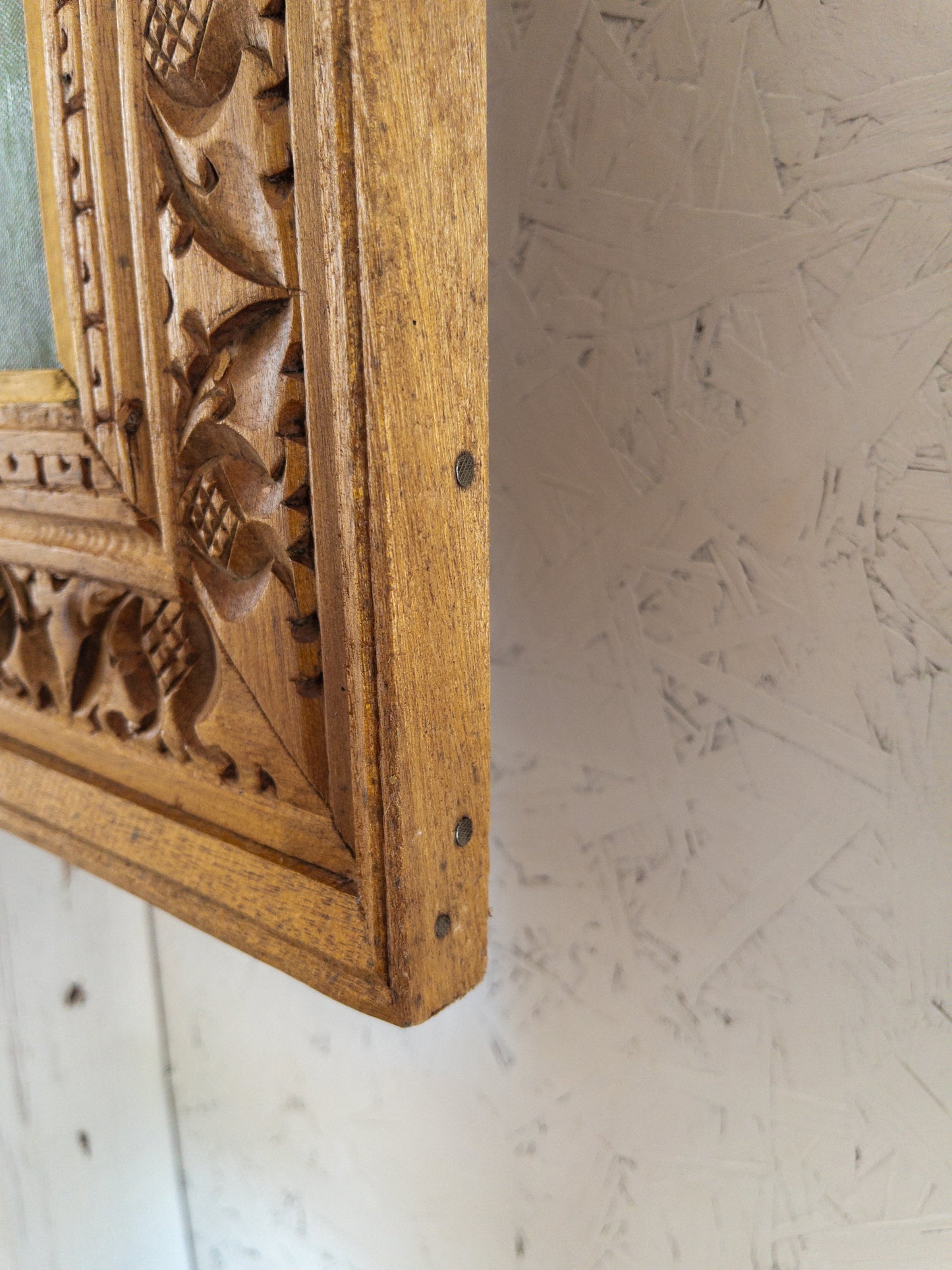 landscape painting in hand carved frame