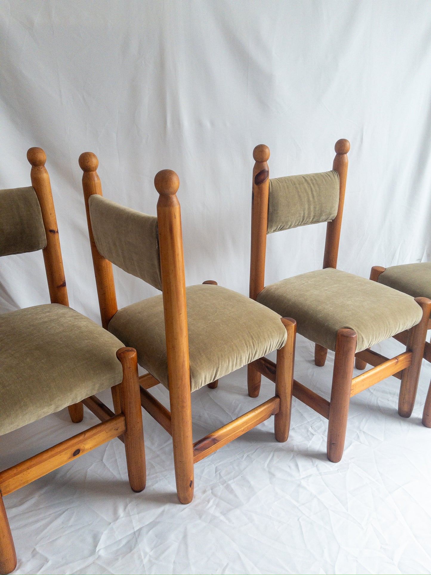 pine and velvet chairs