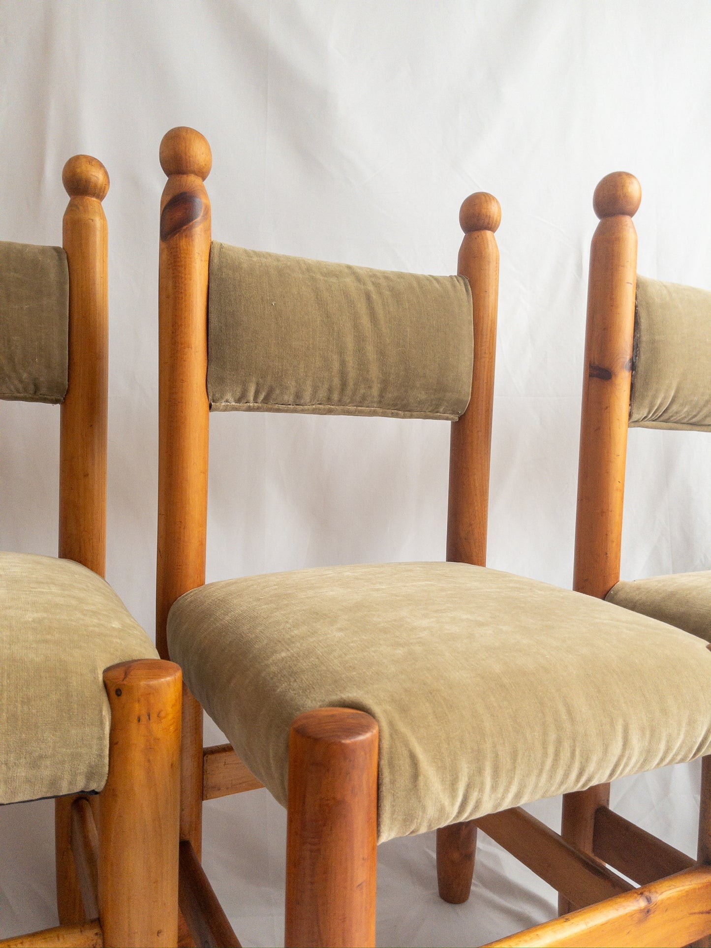 pine and velvet chairs