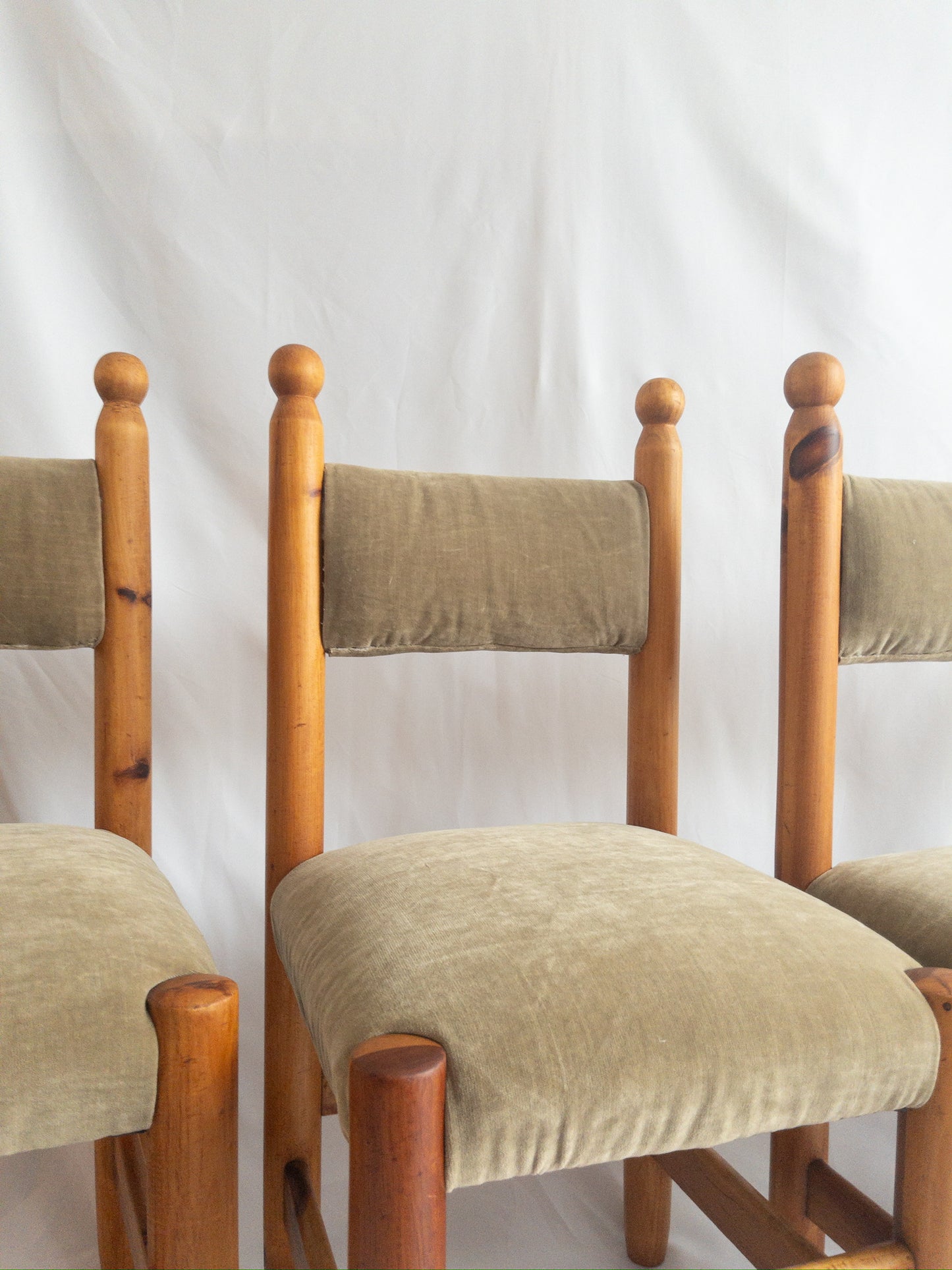 pine and velvet chairs